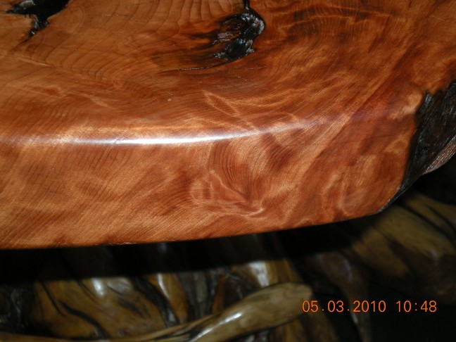 Roundover edging exposes the burl graining.